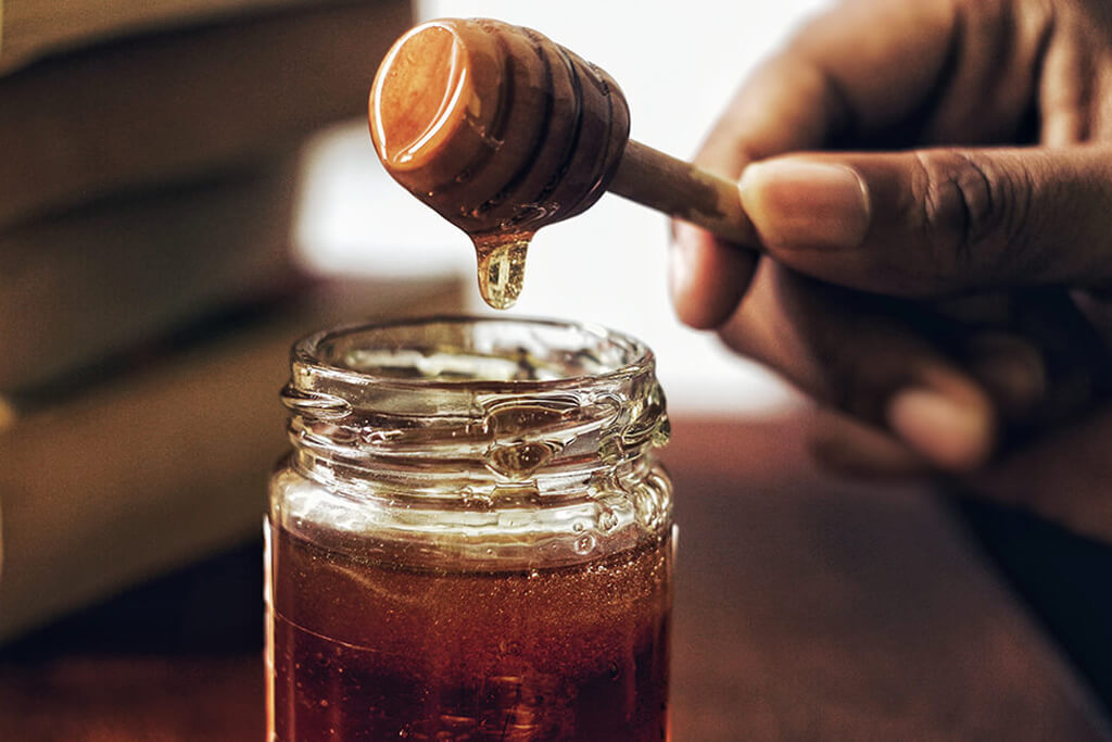 Brookfarm Australian native foods - honey on wooden dipper